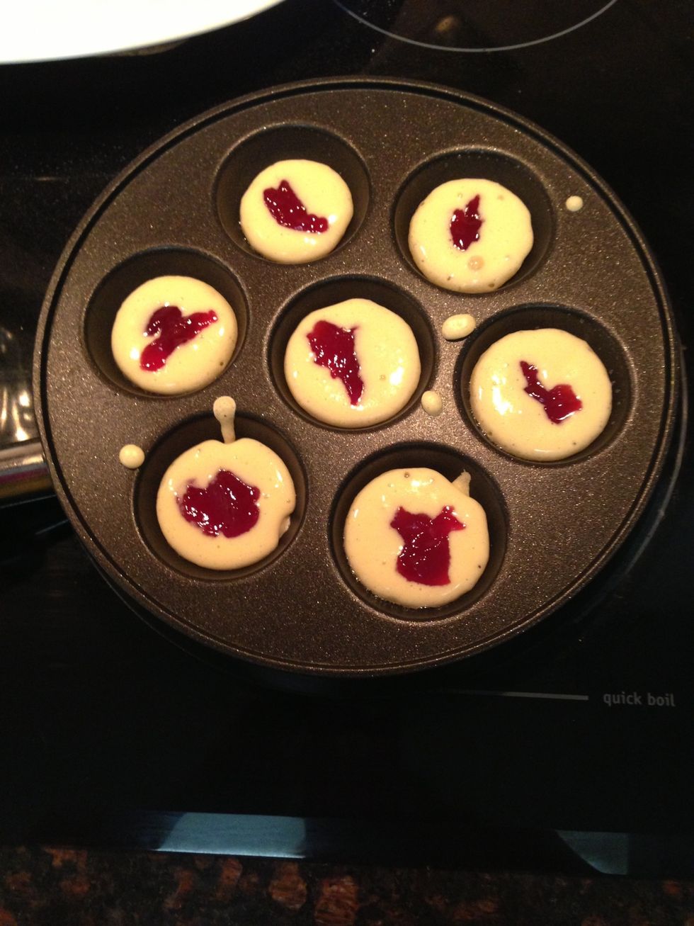 Now add a 1/2 tsp of filling. (Raspberry Jam shown here)