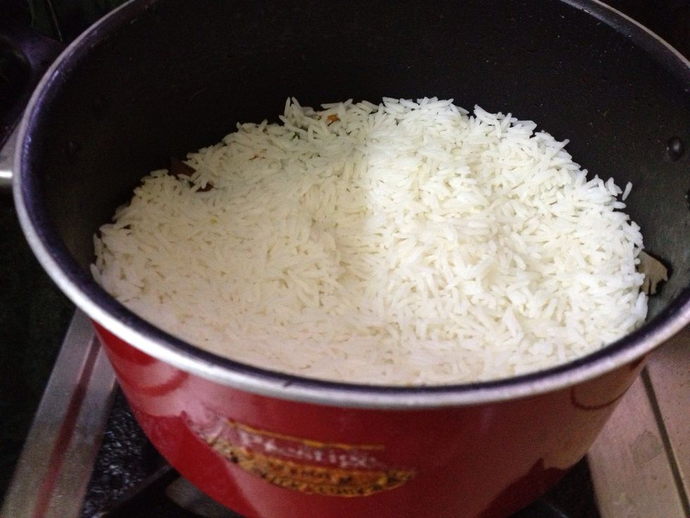 Now add a layer of basmati rice to the cocked vegetable mixture