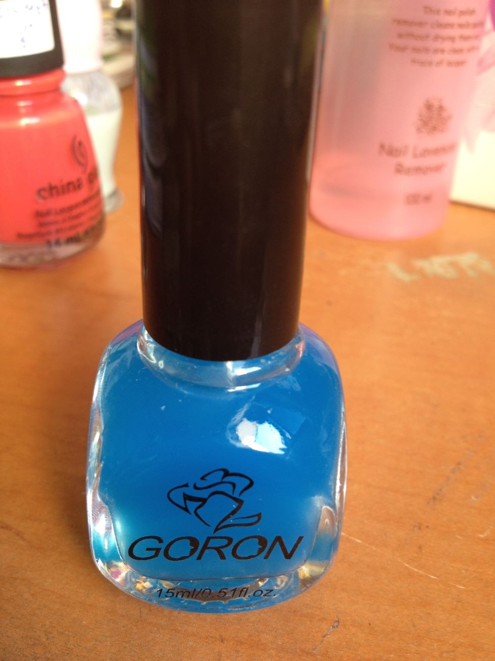 Now add a top coat. I used this cheap top coat that my friend got from one of China's night markets for about SGD$1.00. Not the best, but it works. It's slightly tinted blue.