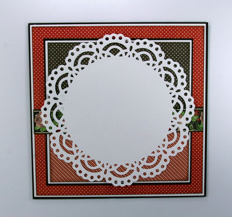 Now add a white doily cut from Crafter's Companion Chantilly Lace Die' sire Die.  You could also substitute any large white paper doily.