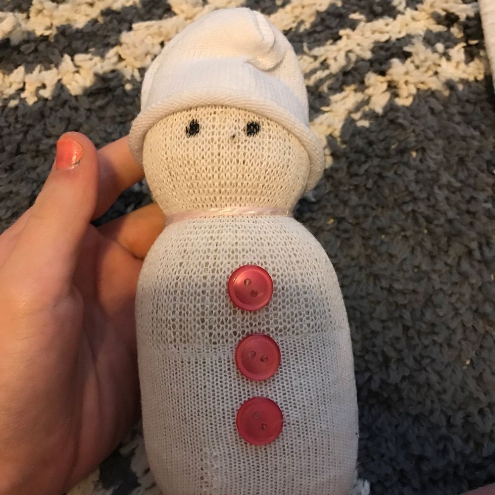Now add buttons and I just made the eyes with marker, if your gonna make a scarf just cut a strip of your tshirt and put it on his neck! Thanks hope you had fun crafting @D crafts