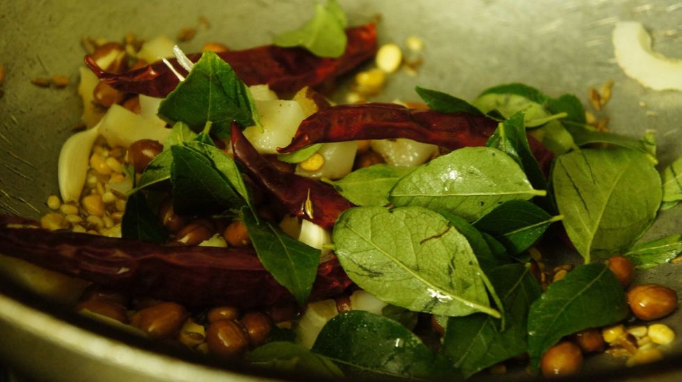 Now add curry leaves then fry till it gets dry..