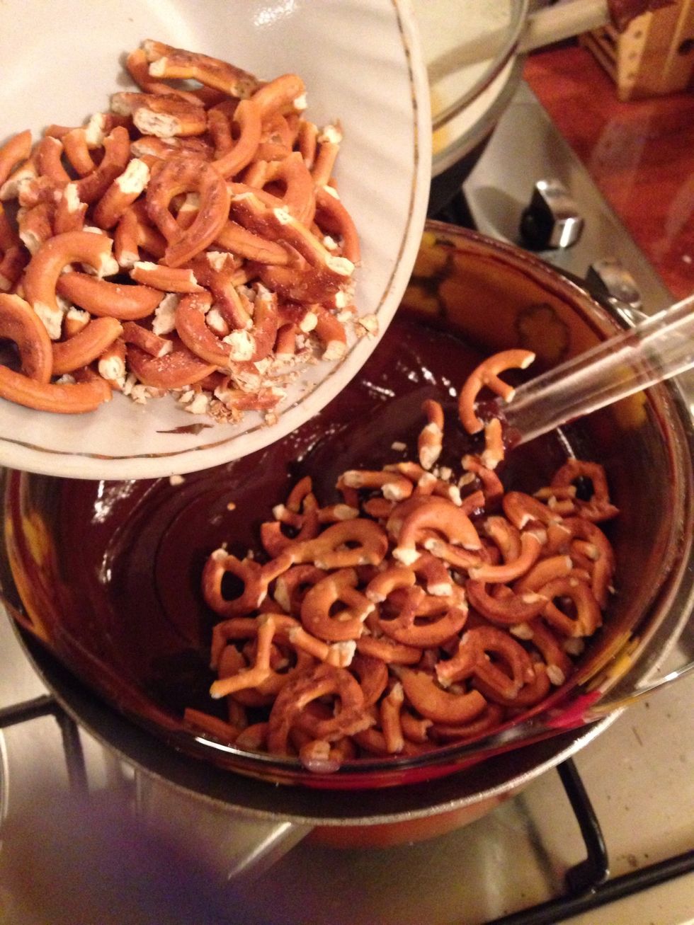 Now add half if your pretzels into the fudge