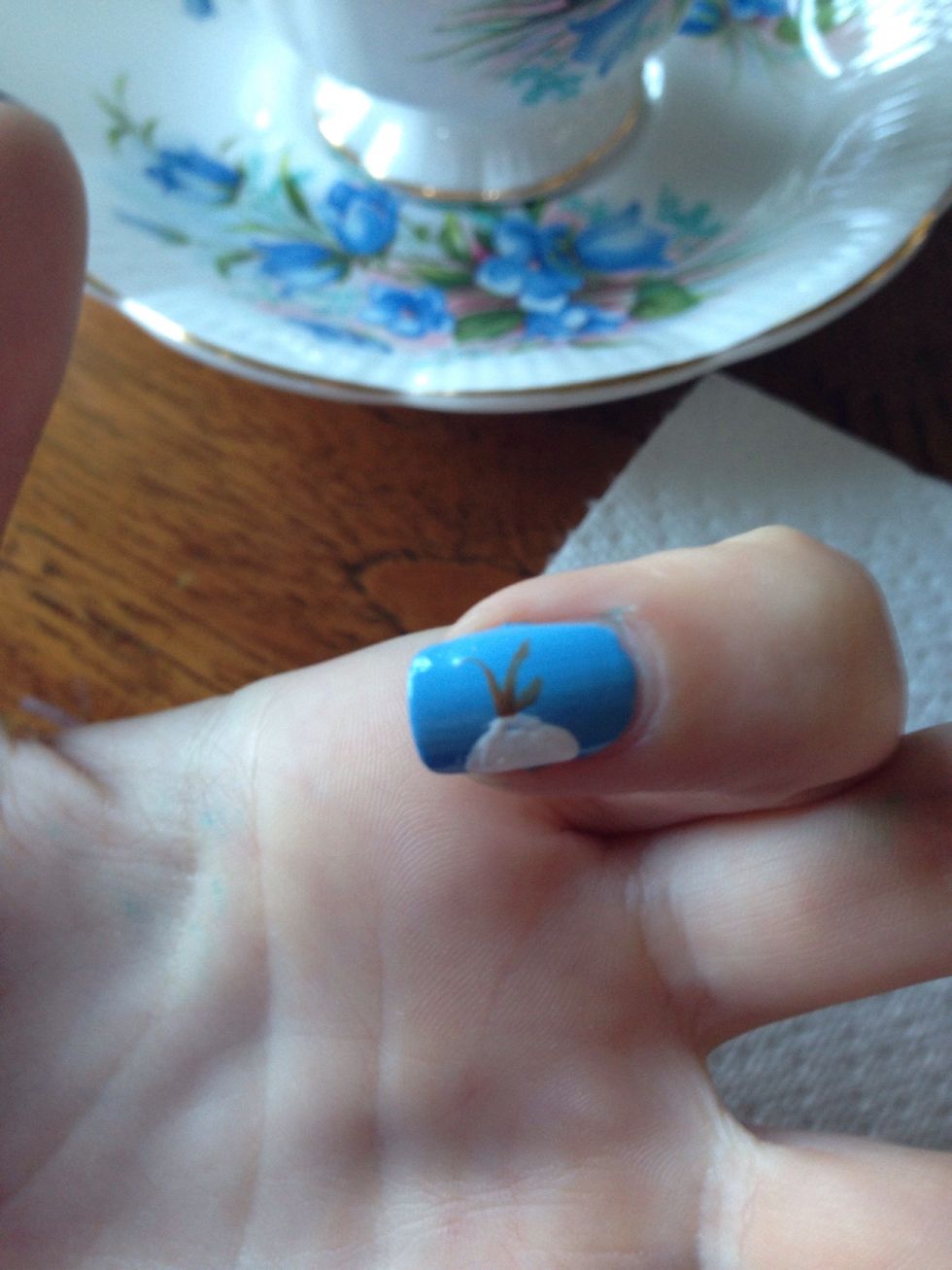 Now add his three tufts of hair in dark brown