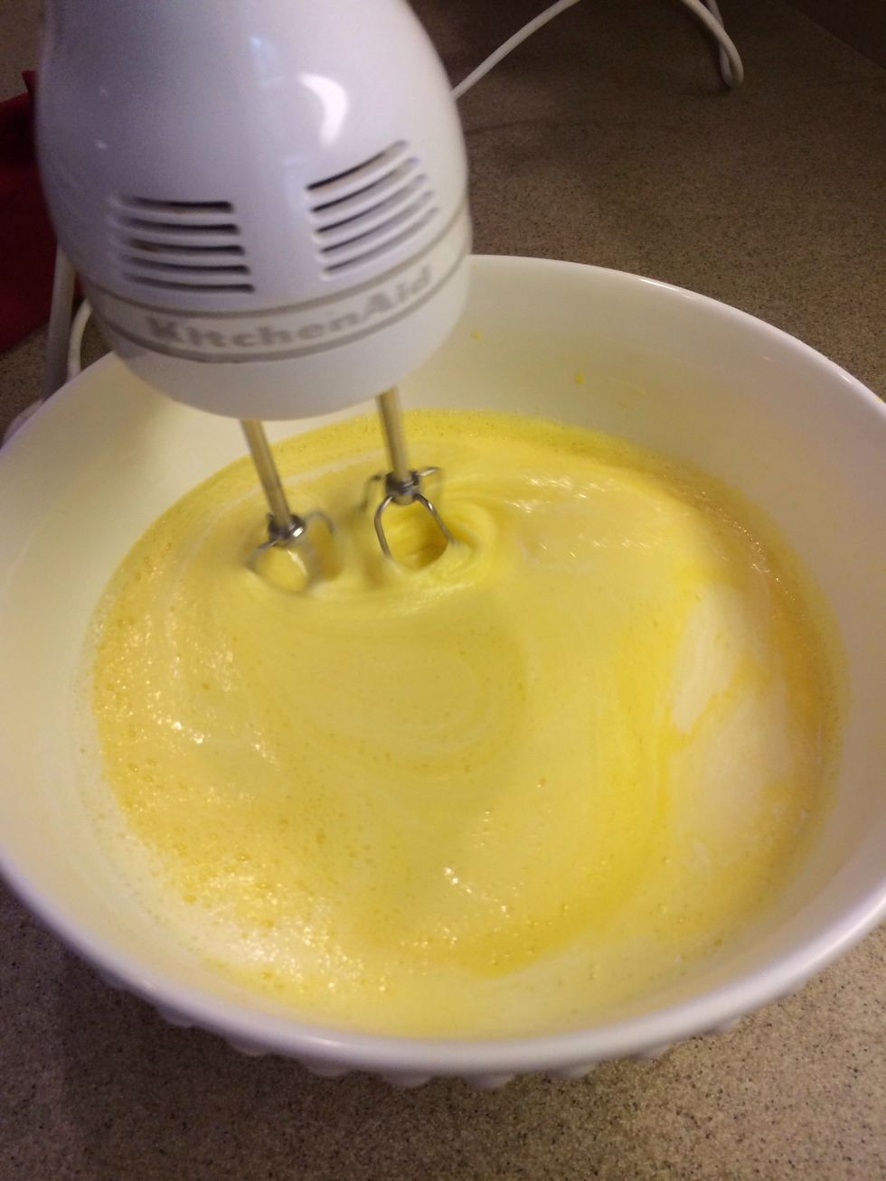 Now add in 2 cups of whole milk (we used half 'n half, which should work too).    Add 2 cups of whipping cream.  Add 2 Tablespoons of Vanilla.  G-Ma Nani just eyeballs it.
