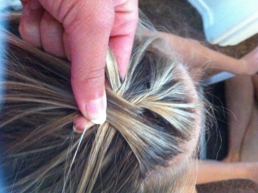 Now add in hair with every stich of the braid and do that all the way down the head.