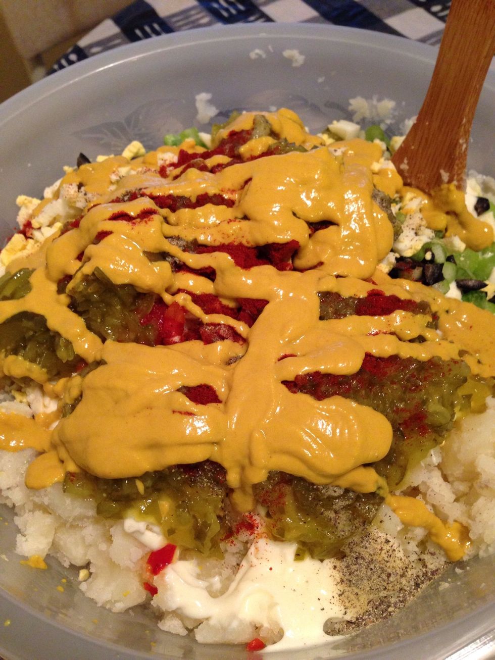 Now add mustard to the mix. Add as much or as little of mustard to your preference. (Remember the more you add the more tangy your potaote salad will taste).