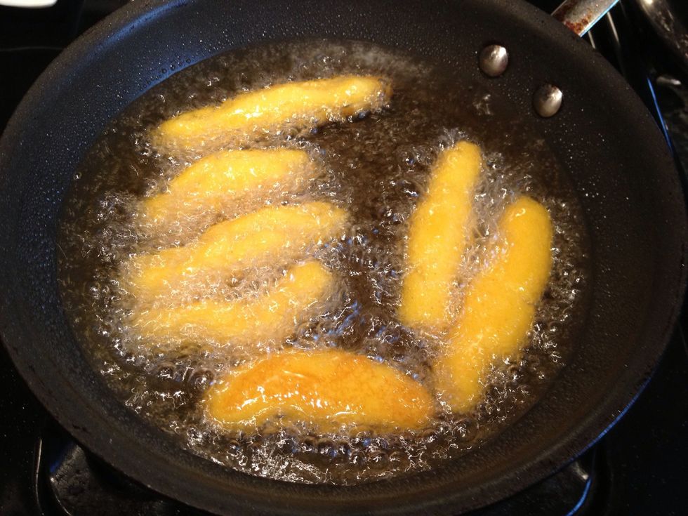 Now add oil to a pan, enough oil to deep fry or they will stick, let the oil get hot and begin frying.