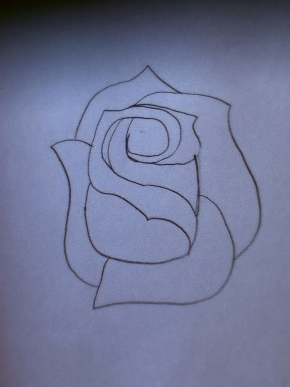 Now, add one big petal starting off to the right and a smaller petal right behind that.