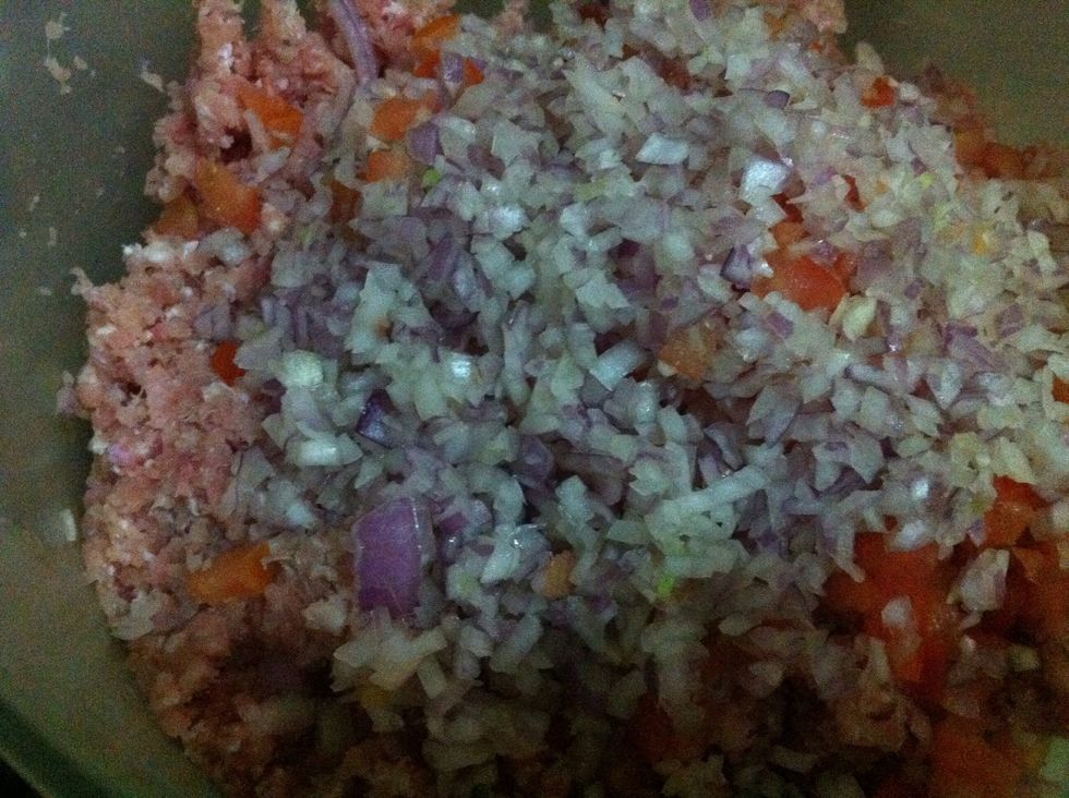 now add onions and tomatoes to it.. make sure tomatoes are properly dry.. you can use paper towel to pat dry.. this should be done to avoid breaking of kebab while frying