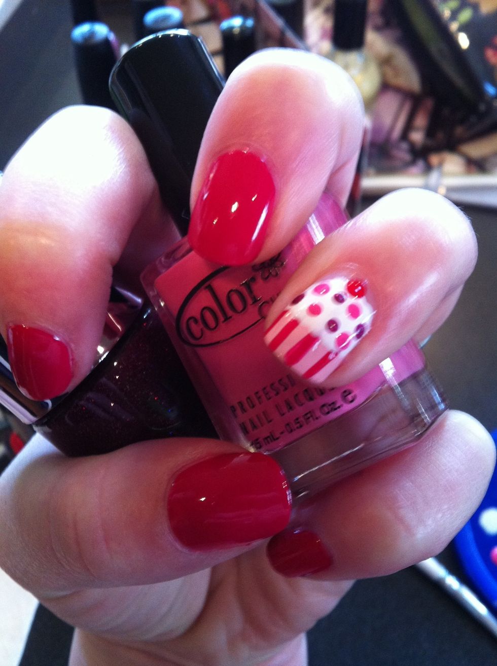 Now add random dots using the dotting tool to create sprinkles. I chose two other coordinating colors pictured here. Don't forget to add a little red cherry on top!