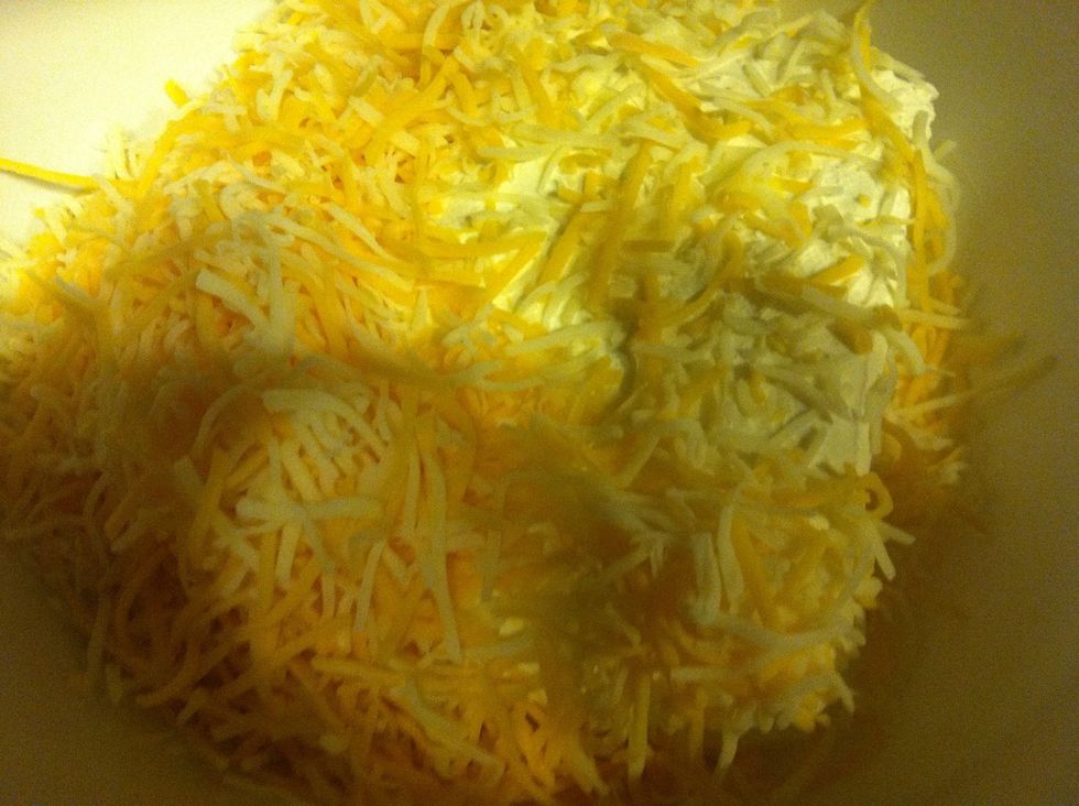 Now add shredded Cheeses to cream cheese & mix until it's a big ball \u27a1