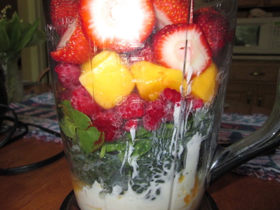 Now, add some frozen fruit. My personal favorites are strawberries, raspberries and mangoes!
