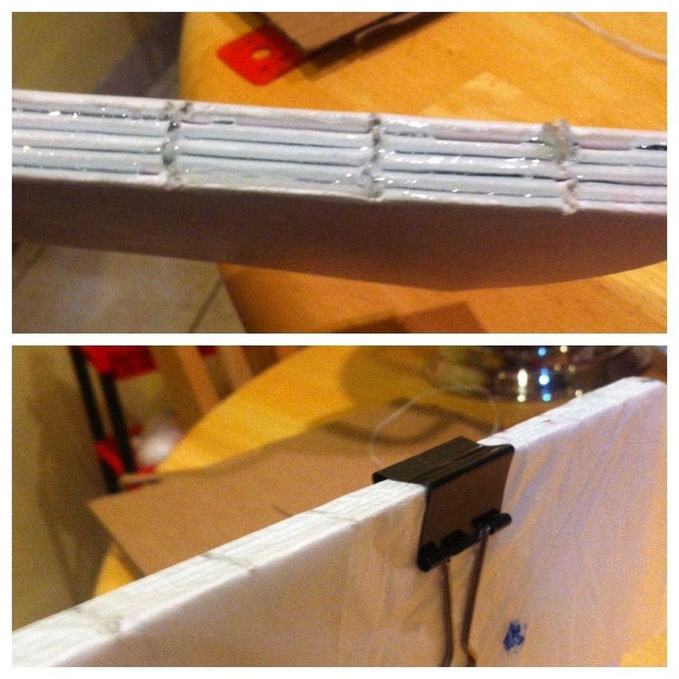 Now add some glue to the spin put the wax paper on with some clips and let it dry