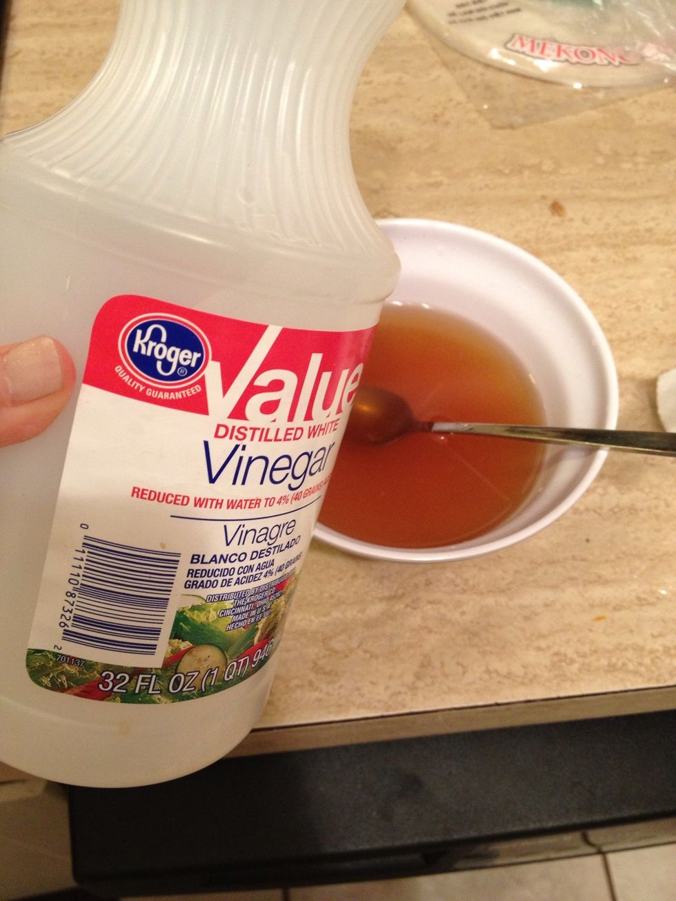 Now add some white vinegar. About 1/4 cup