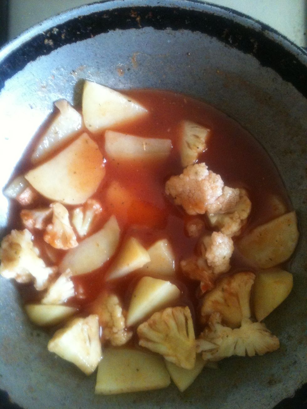 Now add the boiled veggies to the broth with some more ketchup and let it aside for it to soak up the flavor from the broth.