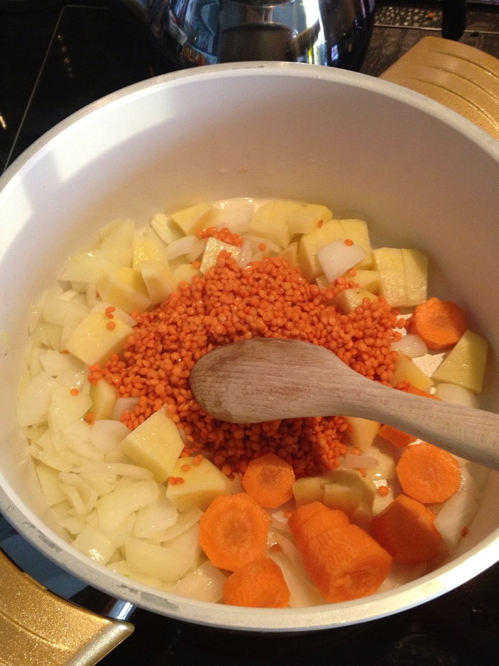 Now add the carrots, potatoes and lentils