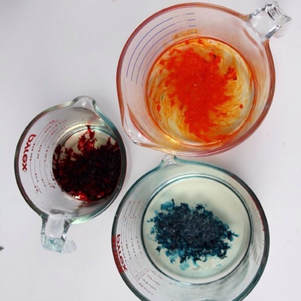 Now add the fragrance oils. I added the Apple Macintosh fragrance to the red wax, the Lemongrass Sage fragrance to the teal wax and the Orange Blossom fragrance to the orange wax.