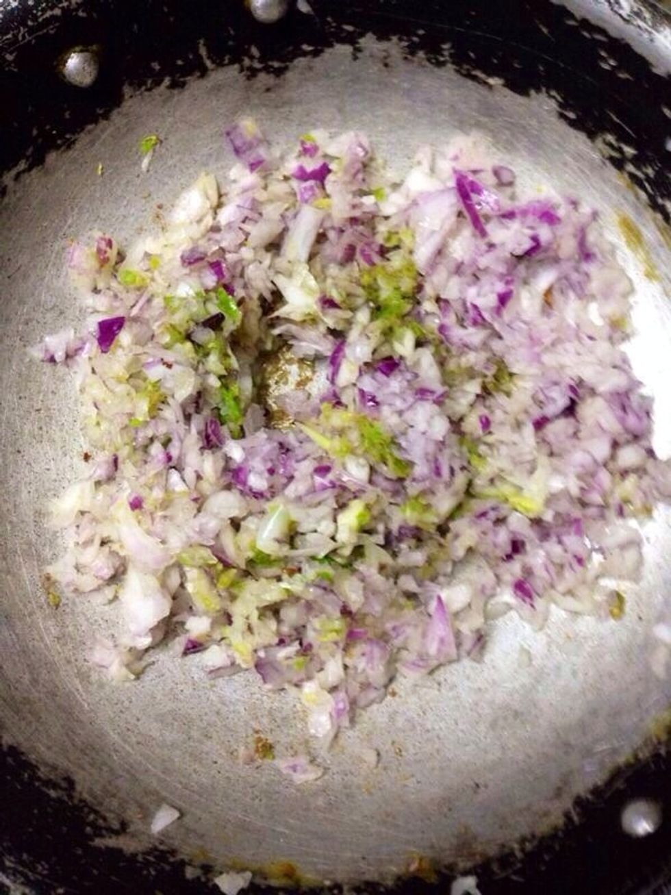 Now add the ginger-chilli-garlic paste. Saut\u00e9 for a minute and add the onions. Cook till the onions turn pink.