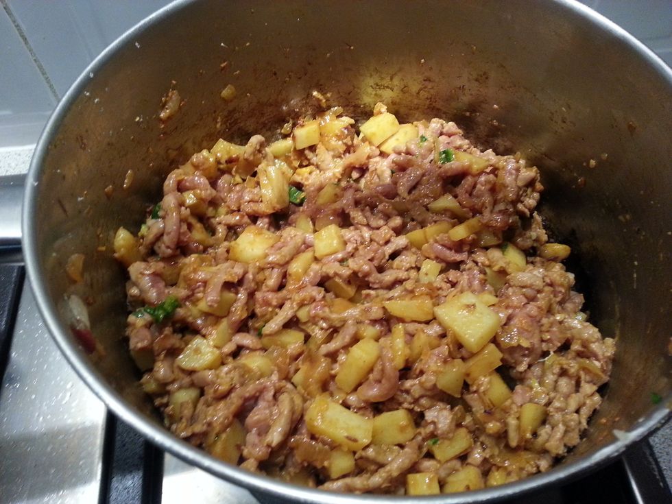 Now add the ground lamb, tomato paste and diced green chilli.