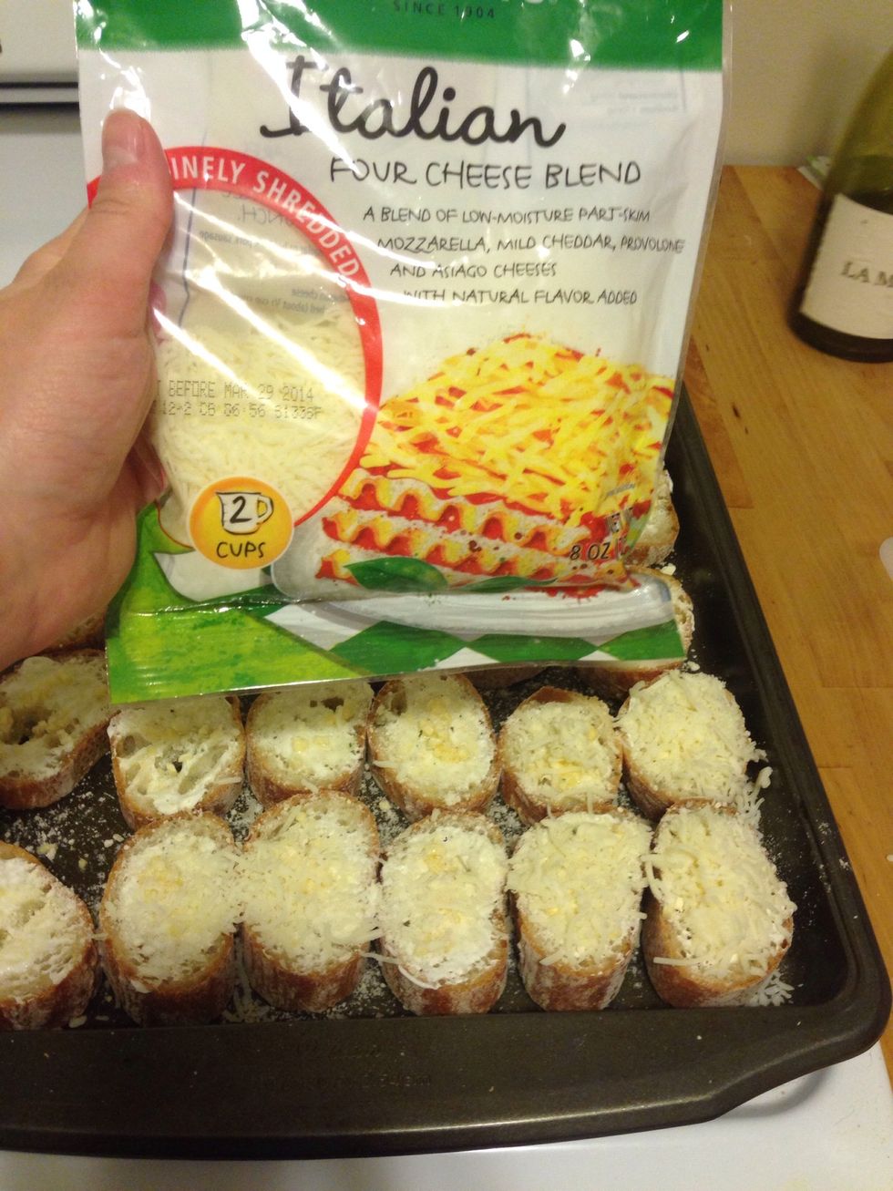 Now add the Italian cheese to the top of the slices.