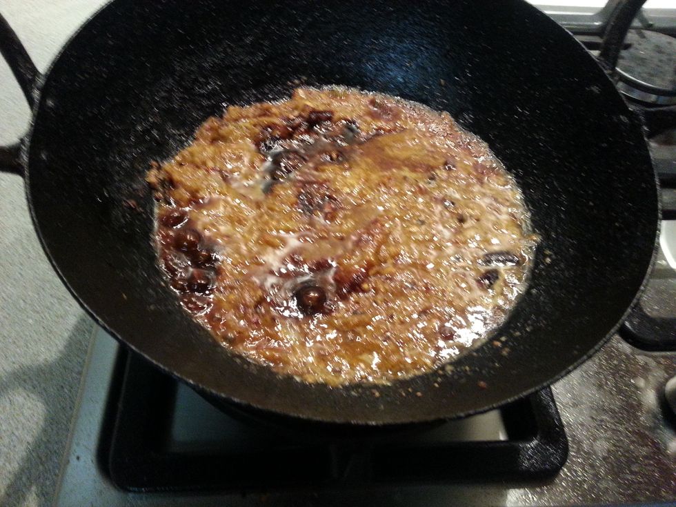 Now add the kicap manis and dark caramel sauce. taste and adjust salt & sugar. Add 1/2 cup of water and fried chilli flakes. Cook this for 15-20 minutes till thick.