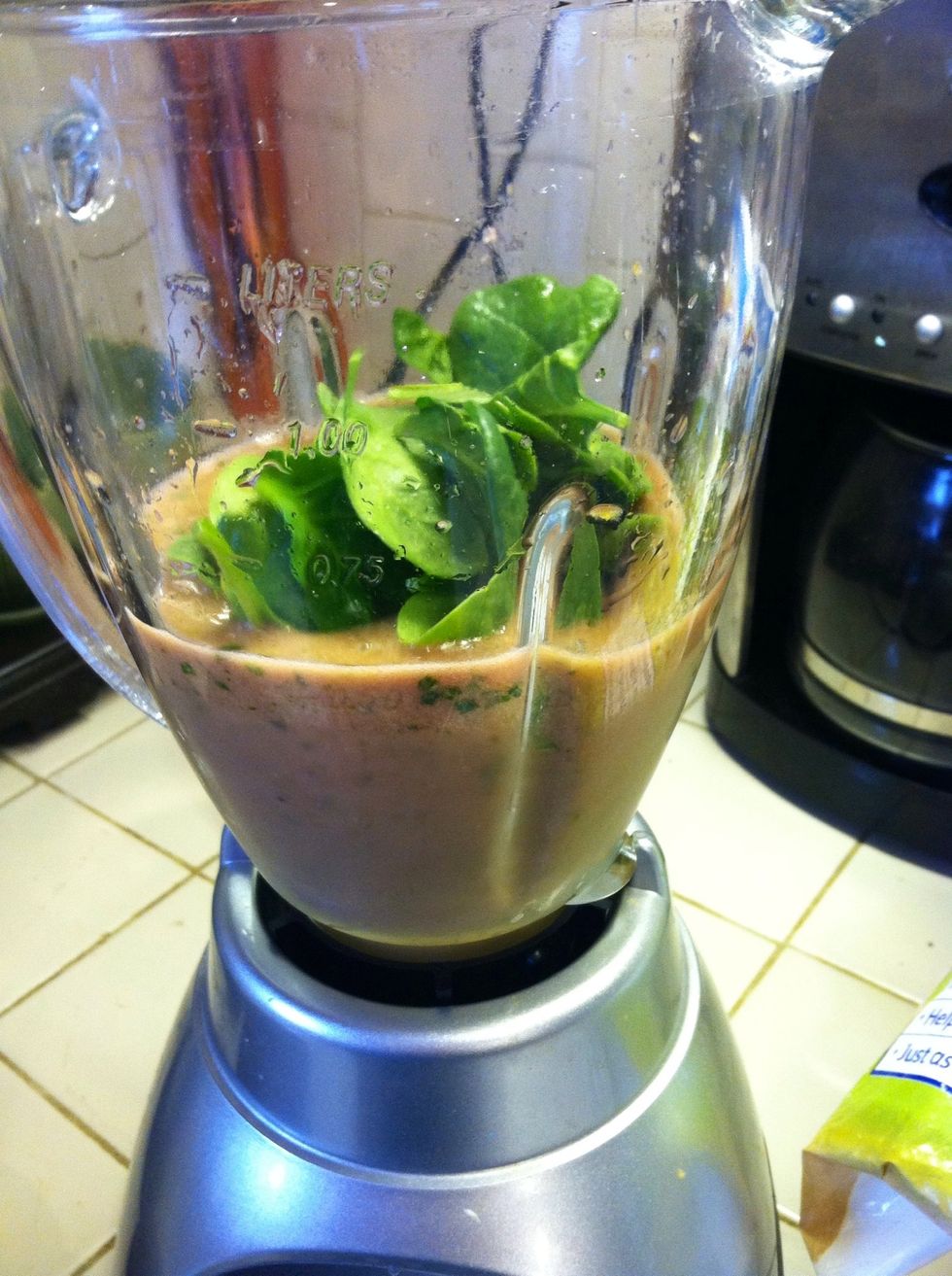 Now add the main ingredient - spinach!