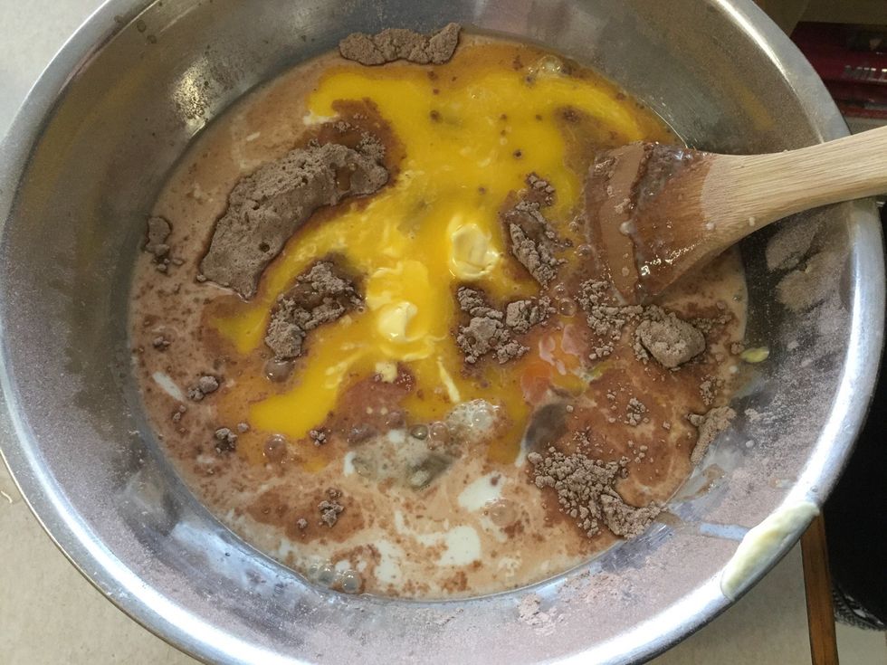 Now add the milk, eggs and butter to the mix.