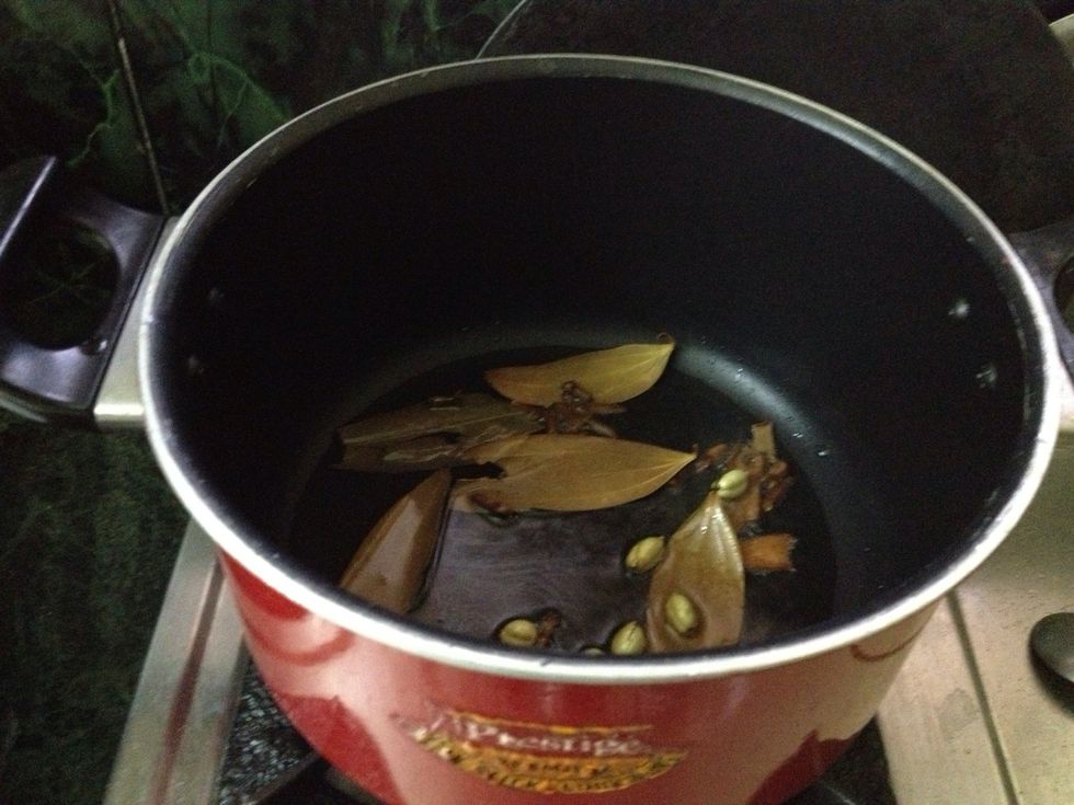 Now add the mixture of cardamom, cloves, biryani leaf