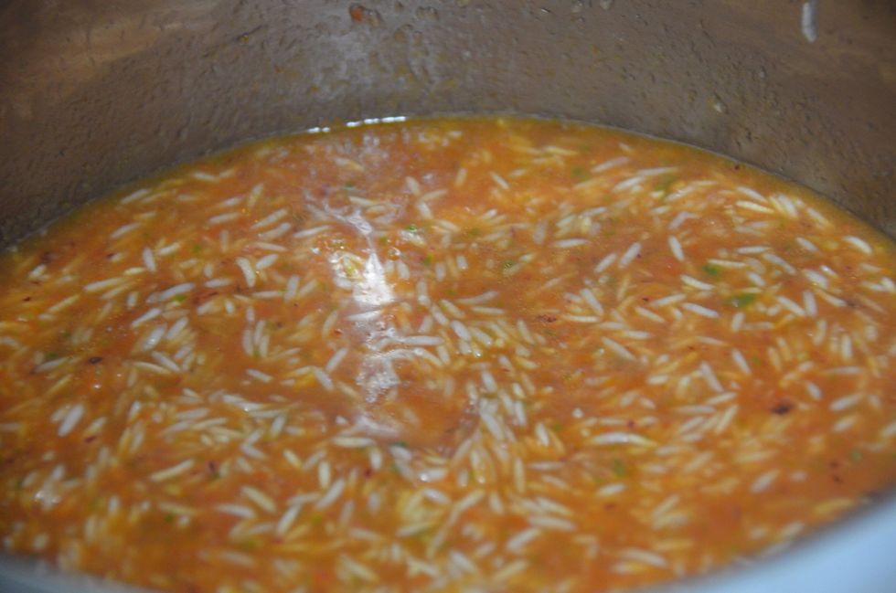 Now add the pur\u00e9e to the rice and 1/2 a cup of water.