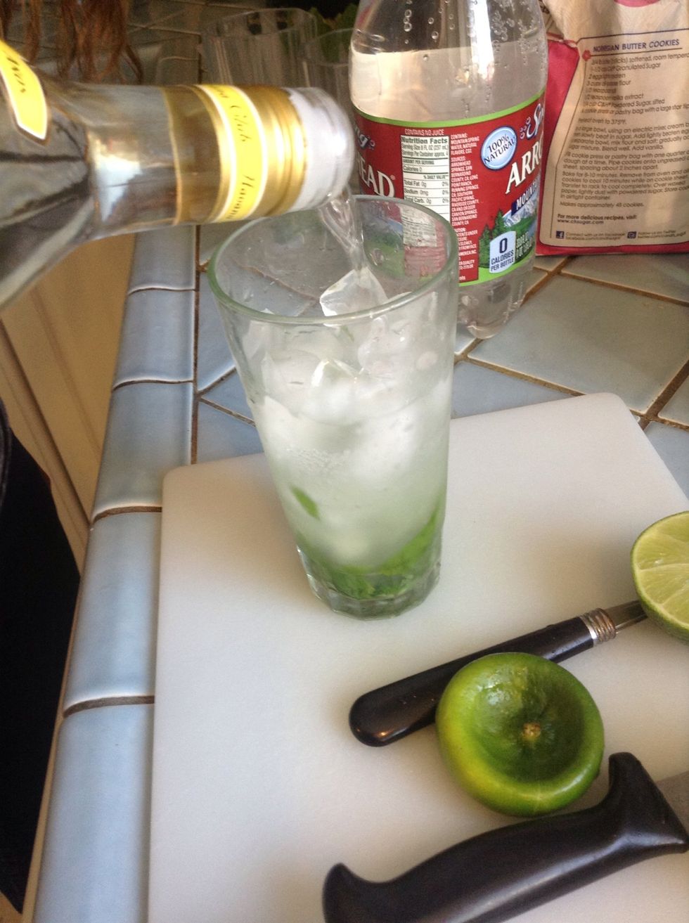 Now add the rum - we doing this about 2 parts sparkling water to 1 part rum. Start with about 1.5 oz. rum and increase depending on how strong you want your mojito.