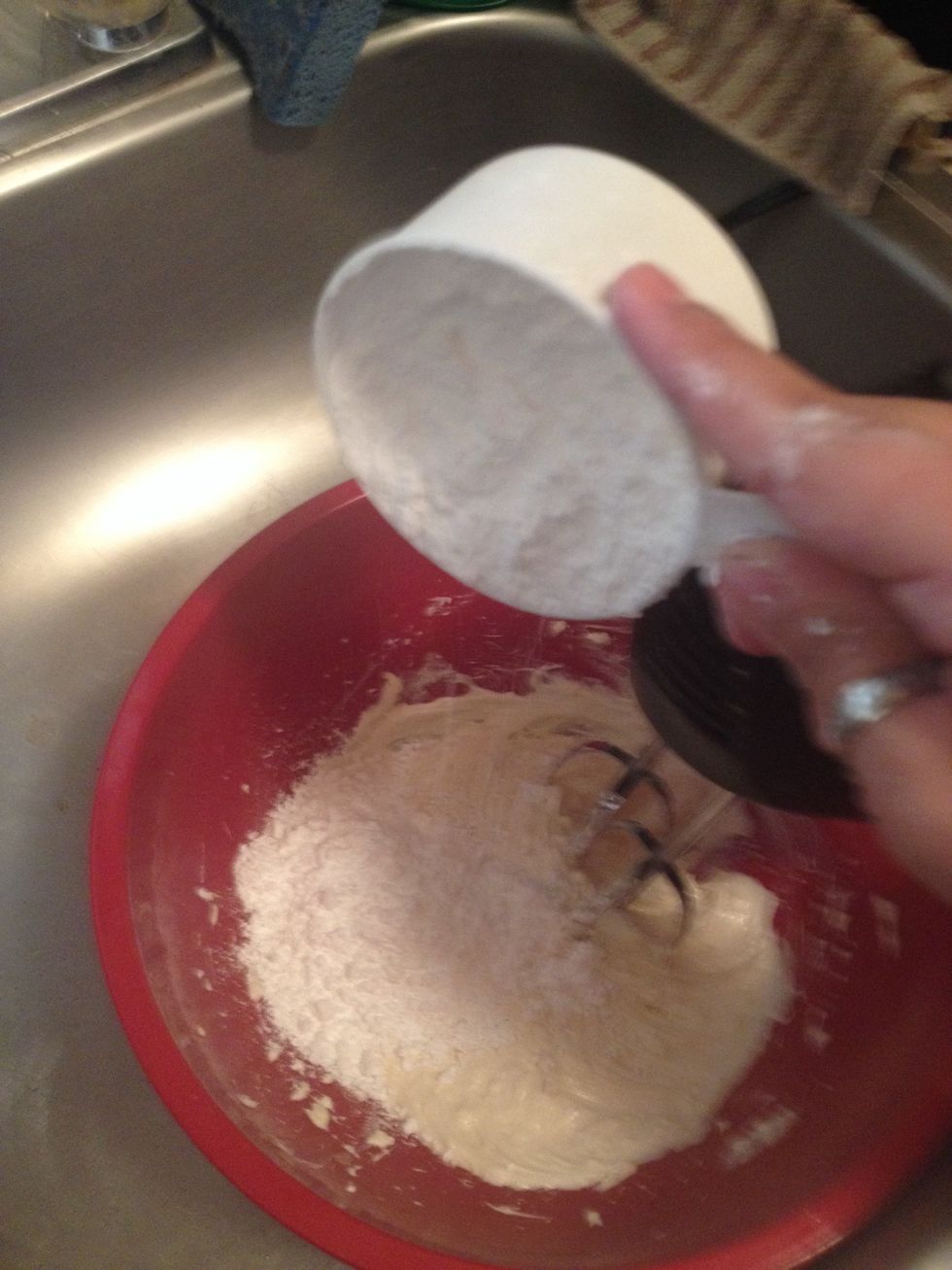 Now add the sugar to the creamed mixture in two or three batches, scraping down the sides of the bowl after each addition.