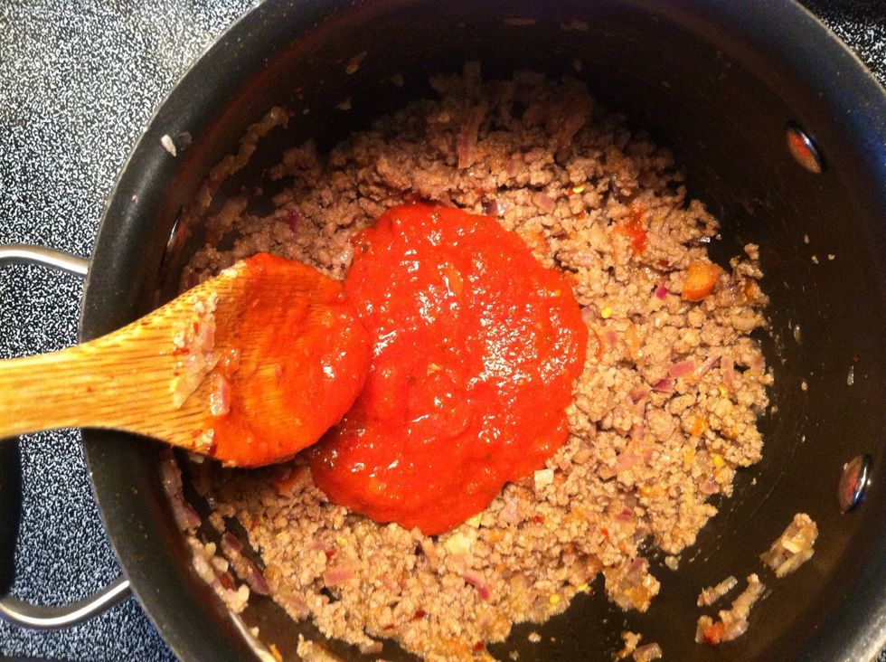 Now add the tomato paste. I sometimes add spaghetti sauce because I always have that on hand ..... and it's inexpensive!
