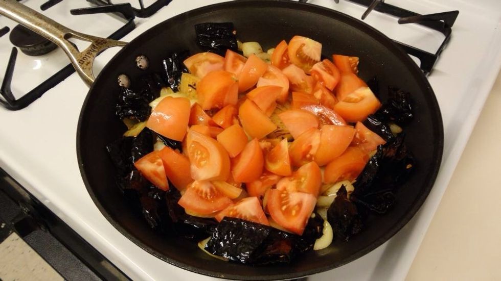 Now add the tomatoes. Cook until soft.