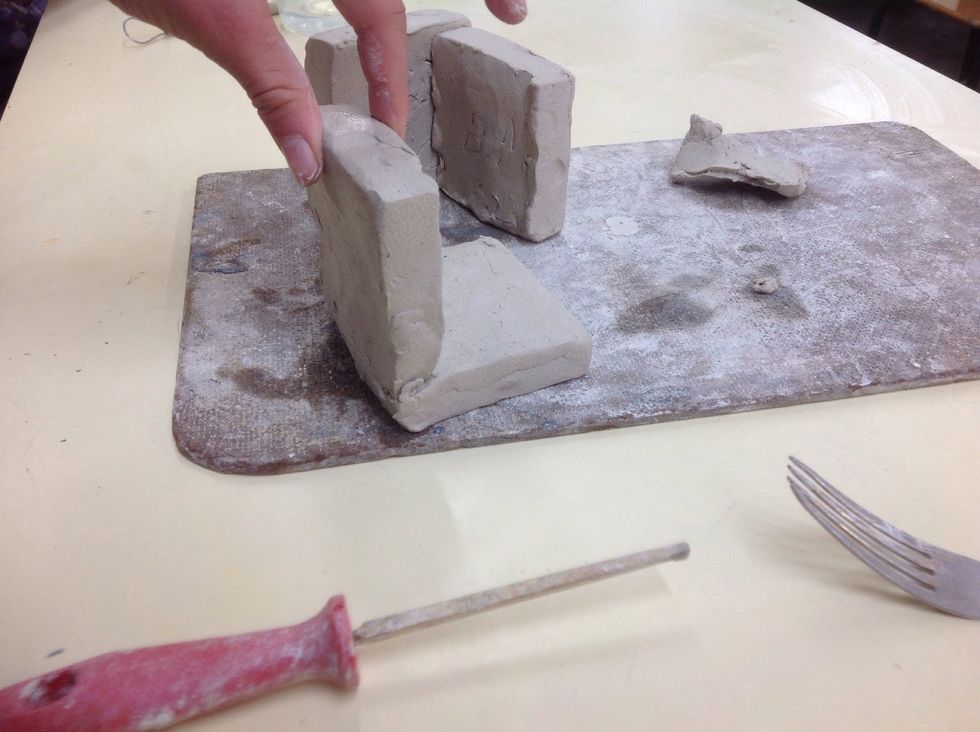 Now add the two scratches together and push down until water starts to come out of the two squares