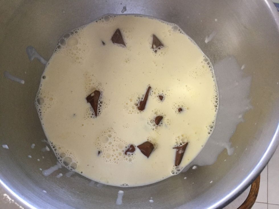 Now add the warm cream with the chocolate.