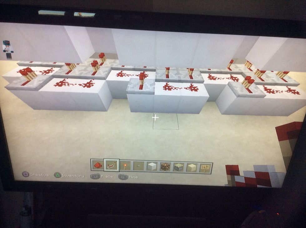 Now add this pattern of redstone and repeaters to the blocks.
