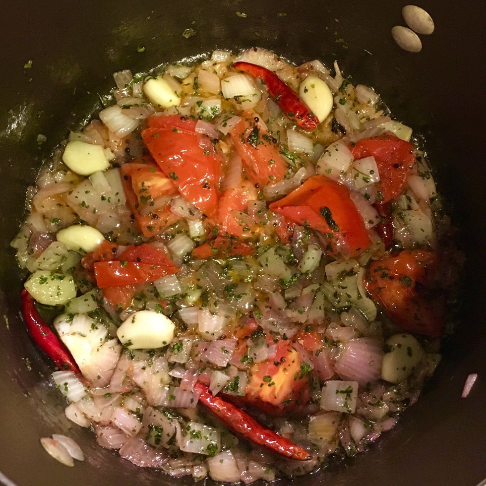 Now add tomato, dried fenugreek leaves and dried cilantro. Saut\u00e9 for about 5 mins.
