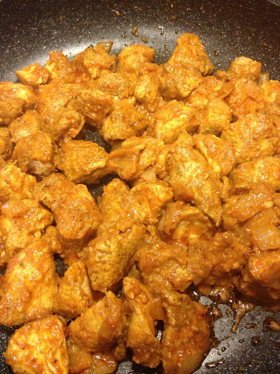 Now add tomato sauce like half a can then I put about 3 tbs of hot chili sauce. This is according to my taste. The chicken is not suppose to be spicy but its suppose to give a kick. Cook 30 mins