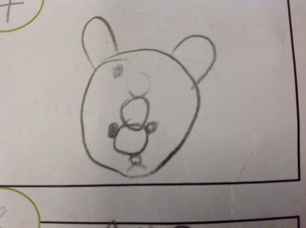 Now add two eye beside the medium circle and two ear and one mouth.