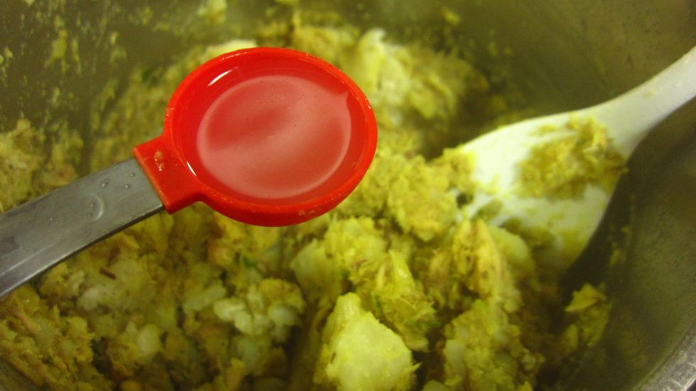 Now add two tablespoons of lime and mix well. Check if you need more salt at this stage. The potatoes absorbs all the salt so it might need more salt.