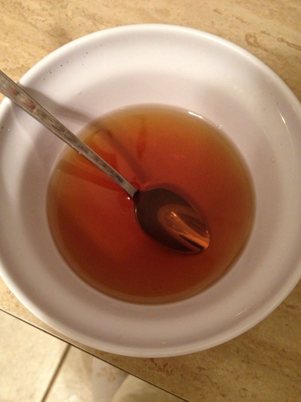 Now add warm water, about a cup. And add 1/2 cup white sugar. Dissolve in the warm water by stirring well.