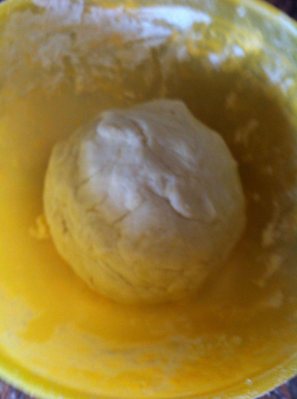 Now add water to it slowly, make sure to mix it while doing so, you don't want too much water, if that happened add more flour to dry it. You want the dough to be not sticky and not dry