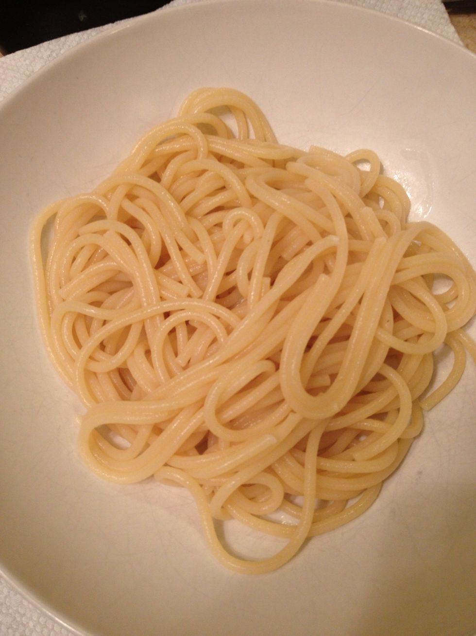 Now add your cooked pasta(I happen to have spaghetti on hand) to a plate.