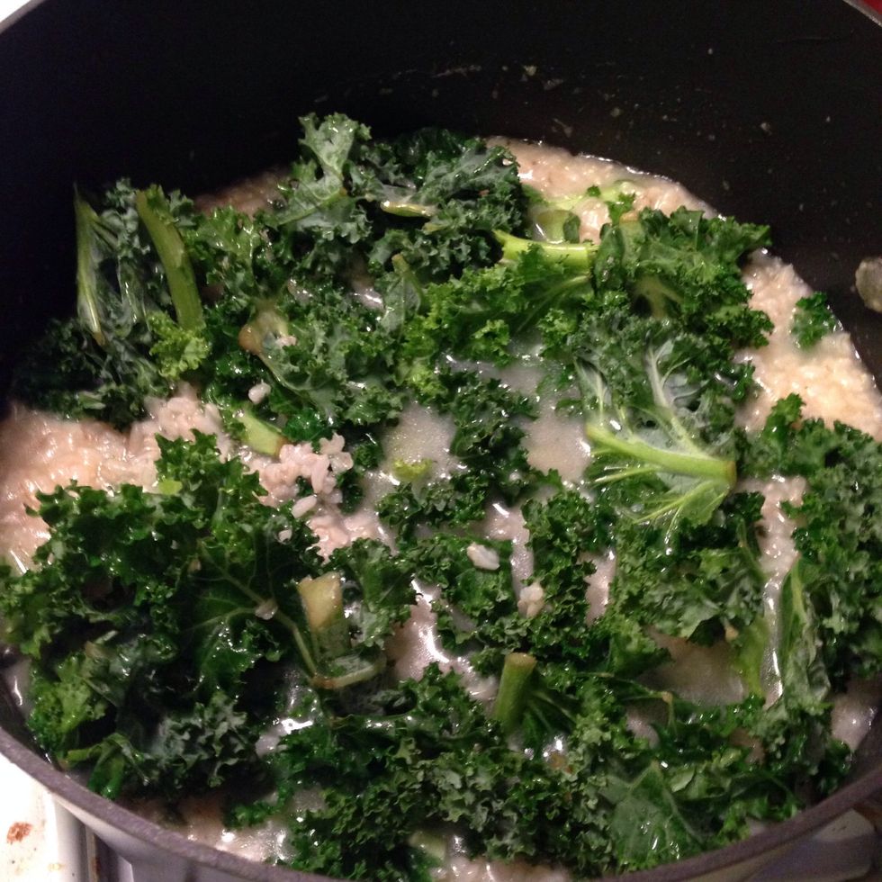 Now add your greens of choice - I used torn Kale greens here. Let those go for about 5 minutes, until wilted.