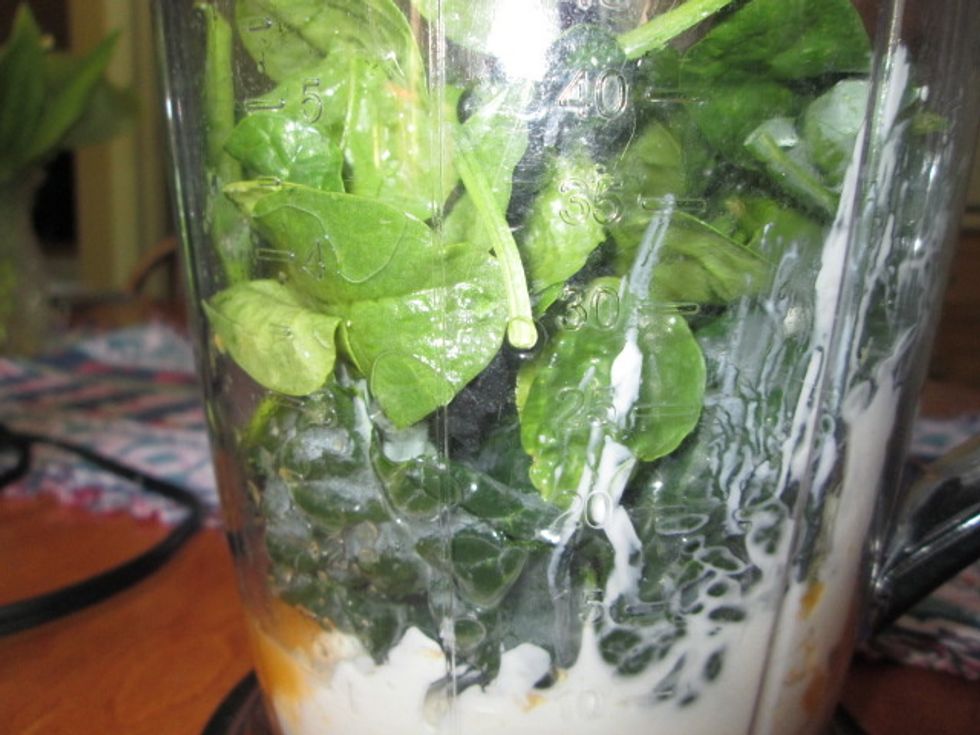 Now, add your greens. You can use any greens you like but my favorites are spinach and kale. Also, try to buy organic when buying your greens because they don't have any harmful pesticides on them :)