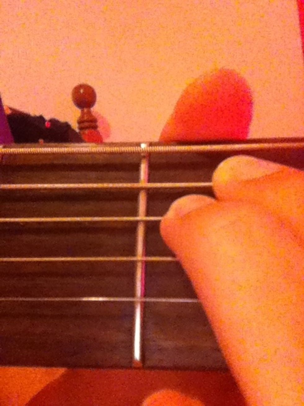 Now add your middle finger to the second fret on the string right below your pointer finger.