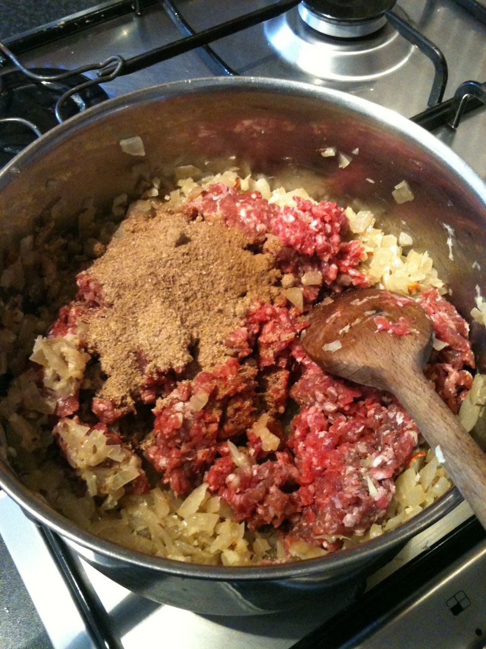 Now add your mince, coriander powder, cumin powder and Garam masala. Stir in well.
