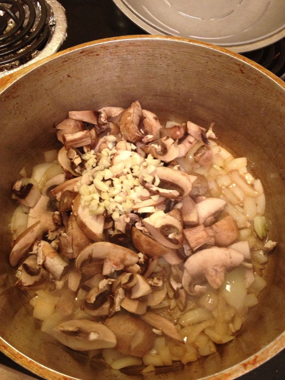 Now add your mushrooms and garlic and stir everything up. About a couple of minutes will do.