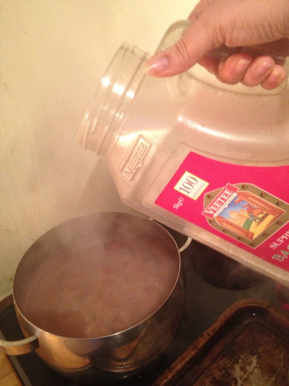 Now add your rice - pour till it just peeks at the top of the water